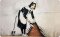 Rannenberg & Friends Schneide- / Frühstücksbrettchen "Sweep it under the Carpet" von Banksy